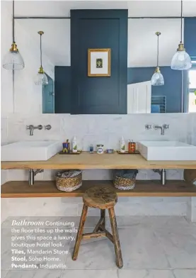  ??  ?? Bathroom Continuing the floor tiles up the walls gives this space a luxury, boutique hotel look.Tiles, Mandarin Stone.Stool, Soho Home.Pendants, Industvill­e.