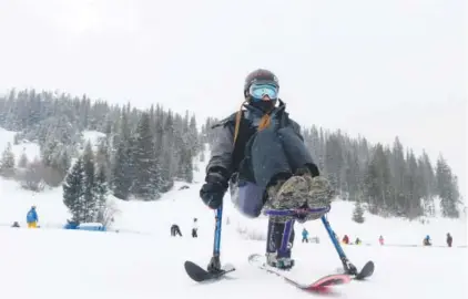  ??  ?? Kailyn Forsberg makes a solo run on a monoski Saturday at Winter Park during her first day back on the snow since being paralyzed in a slopestyle skiing accident last year. AAron Ontiveroz, The Denver Post