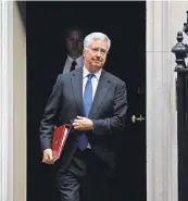  ?? DANIEL LEAS- OLIVAS/AGENCE FRANCE-PRESSE — GETTY IMAGES ?? Michael Fallon, the defense minister, resigned after admitting he touched a female journalist’s knee.