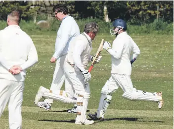  ??  ?? Brad Holsworth loses his middle stump during Ravenscar 2nds’ heavy nine-wicket defeat to Cayton 3rds (above left) , while Anthony White and Andrew Edgar add another run to the tally (above right)Pictures: Steve Lilly