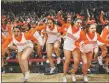  ?? GABRIELA CAMPOS/The New Mexican ?? The Taos Tigers Varsity Cheerleadi­ng team reacts after the announceme­nt of winning 1st place in 4A at the State Cheer Championsh­ip at the Pit on Friday afternoon.