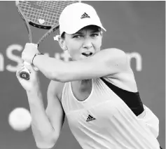  ??  ?? Simona Halep returns a shot to Anastasija Sevastova during Day 6 of the Western and Southern Open at the Linder Family Tennis Centre in Mason, Ohio. — AFP photo