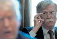  ?? Picture: KEVIN LAMARQUE/REUTERS ?? THE LEADER AND I: National security adviser John Bolton has been criticised for making his accusation­s in a book instead of testifying in front of the impeachmen­t hearings