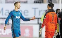  ?? MARTIN RICKETT POOL/AFP VIA GETTY IMAGES ?? Tottenham Hotspur goalkeeper Joe Hart, left, talks to Marine goalkeeper Bayleigh Passant after Sunday’s game.