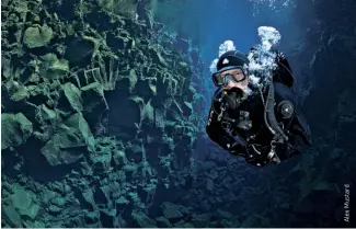  ??  ?? bottom A diver explores the Silfra rift, a deep fault filled with fresh water in the rift valley between the Eurasian and American tectonic plates at Thingvelli­r National Park, Iceland