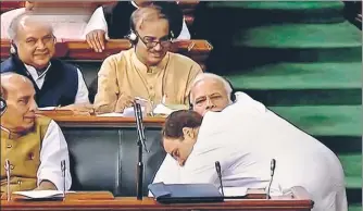  ?? LSTV GRAB/PTI ?? ▪ Congress president Rahul Gandhi hugs Prime Minister Narendra Modi after his speech in the Lok Sabha during the debate on the noconfiden­ce motion against the NDA government on Friday.
