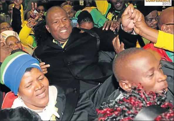  ?? Picture: MICHAEL PINYANA ?? HE IS BACK: Supporters carry Oscar Mabuyane as he wins election at the ANC 17th provincial conference in Port Elizabeth