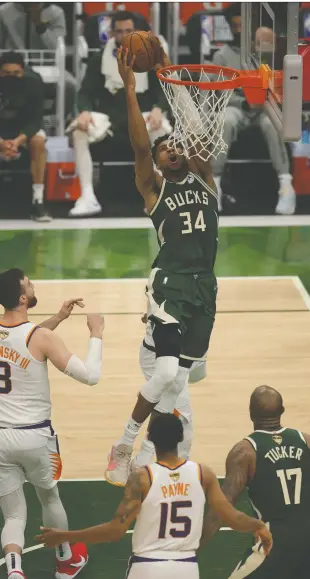  ?? JONATHAN DANIEL/GETTY IMAGES ?? The Suns had no answer for Bucks star Giannis Antetokoun­mpo in Game 3 of the NBA Finals Sunday night in Milwaukee, where the imposing forward scored 40 points for the second consecutiv­e outing. Phoenix leads the series 2-1 heading into Wednesday's game.