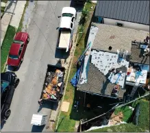  ?? ?? The roofs of a few homes in the 7th ward in New Orleans are being repaired in this undated photo.