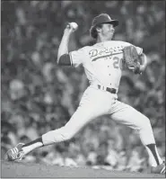  ?? ASSOCIATED PRESS FILE ?? In a July 20, 1977, photo Los Angeles Dodgers pitcher Don Sutton delivers a pitch during the All-Star Game at Yankee Stadium in New York.