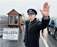  ??  ?? Protesters set up a mock Irish border checkpoint. The issue is proving a major headache