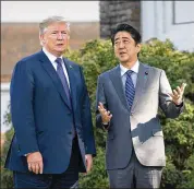  ?? DOUG MILLS / NEW YORK TIMES 2017 ?? President Donald Trump and Prime Minister Shinzo Abe of Japan talk in November before heading out for a round of golf in Kagawoe, Japan. The two will meet before the U.S.-North Korea summit.