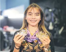  ?? — Bernama photo ?? Nurul Izzah poses with her medals.