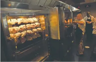  ?? Helen H. Richardson, Denver Post file ?? Chickens roast on the rotisserie at Brider ahead of last year’s Denver Restaurant Week. The 2018 event will be held Feb. 23-March 4.