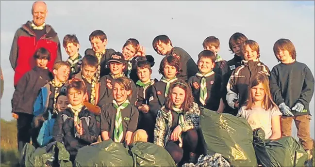  ??  ?? Newport Cub Scout Group opens the new term with a beach clean-up at Wormit, collecting bags of rubbish — including a kitchen sink.