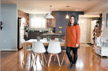  ?? MARVIN JOSEPH/WASHINGTON POST ?? Eliana Kee, 33, stands near the kitchen of the Arlington, Virginia, town home she and husband Brian bought for $515,000.