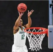  ?? Eric Gay / Associated Press ?? Baylor guard Moon Ursin, who finished with a game-high 24 points, shoots during the first half.