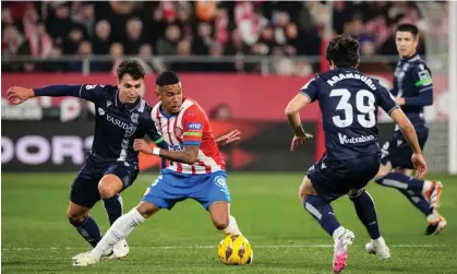  ?? ?? Sávio (centre) in action for Girona, where is he on loan from another CFG-affiliated club, Troyes. Photograph: David Borrat/EPA