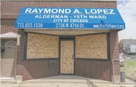  ?? ANTHONY VAZQUEZ/SUN-TIMES ?? The windows of Ald. Ray Lopez’s 15th Ward office, 2736 W. 47th St., were boarded up on Monday after two people threw bricks at the office.