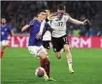  ?? | PHOTO : AFP ?? Pavard et les Bleus ont souffert face à Florian Wirtz.