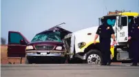  ?? GREGORY BULL/ASSOCIATED PRESS ?? Officers work at the scene of a deadly crash in Holtville, Calif., on Tuesday. Authoritie­s say a semi-truck crashed into an SUV carrying 25 people, killing at least 13 people.