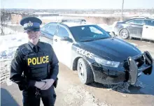  ?? JASON BAIN/EXAMINER ?? New Peterborou­gh County OPP community services and media relations officer Const. Cass Jackson poses near a cruiser parked at the Lansdowne St. E detachment on Monday. It was her first day on the job solo, following the departure of Const. Jason Folz,...