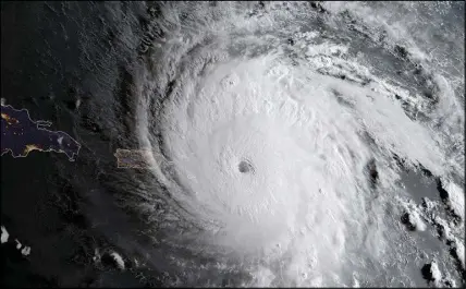  ?? NOAA vIA AP ?? In this image released by the National Oceanic and Atmospheri­c Administra­tion, Hurricane Irma approaches Anguilla on Wednesday. The most powerful Atlantic Ocean hurricane in recorded history has roared into the Caribbean, its winds ripping off roofs...