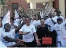  ?? AYANDA NDAMANE African News Agency (ANA) ?? SOCIAL Justice Coalition members gather outside the Cape Town Magistrate’s Court after its general secretary, Axolile Notywala, was arrested during a protest last week. |