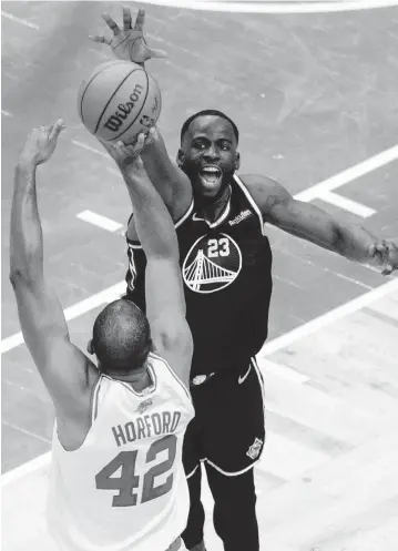  ?? CARLOS AVILA GONZALEZ AP ?? Warriors forward Draymond Green defends against the Celtics' Al Horford during Game 3 of the NBA Finals on Wednesday. Green is shooting just 23% in the series and averaging 4.3 points.