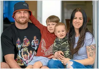  ?? KAVINDA HERATH/STUFF ?? Tony Lamborn with elder son Jack, baby Quinn, and wife Abby in January last year. Lamborn, who has a constructi­on firm in Hawke’s Bay, is building a new house for the family and plans to move in before Christmas.