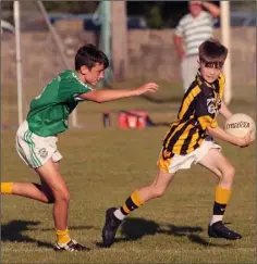  ??  ?? Joshua Roche of Shelmalier­s is chased by Cian Levingston.