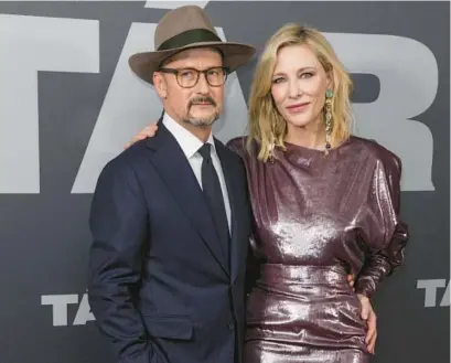  ?? SCOTT GARFITT/AP ?? Director Todd Field and Cate Blanchett pose for photograph­ers upon arrival at the premiere of the film “Tár” in London on Jan. 11.