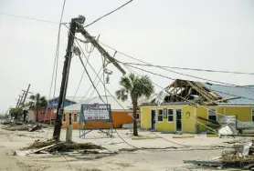  ?? Tarnowski, © The New York Times Co. Bryan ?? Electric poles toppled by Hurricane Ida in Grand Isle, La., in September. The storm left millions without power for days.