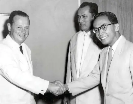  ??  ?? Tan Sri Dol Ramli ( right), head of the Malay Services Division, greets American Ambassador to Malaya Homer Byington in 1958, as Tan Sri Ahmad Merican looks on. — Photos: Handout