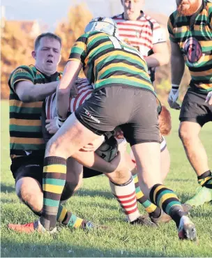  ?? J Howard ?? ●●Action from Littleboro­ugh RUFC’s clash against Aldwinians