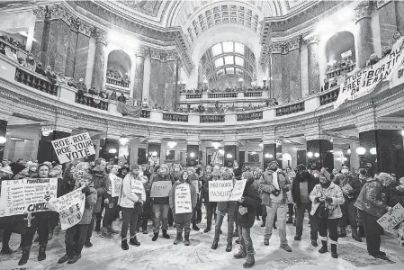  ?? MORRY GASH/ AP ?? Protesters against the 1849 state ban on abortion rally in the Wisconsin Capitol in Madison on Jan. 22.