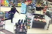  ?? CHONA KASINGER THE NEW YORK TIMES VIA THE NEW YORK TIMES ?? Kyong Barry, manager in a Safeway store in Auburn, Wash., said she has noticed that longtime customers of the store have begun stealing.
An image from a video shows a customer pelting a crouched employee with items from a store's displays.