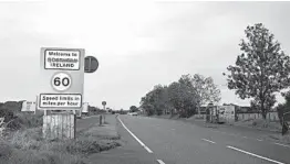  ?? CHARLES MCQUILLAN/GETTY ?? A defaced sign is seen this week at the border of Northern Ireland and Ireland.