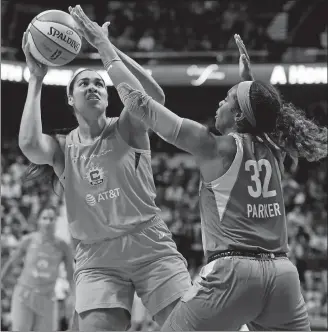  ?? SEAN D. ELLIOT/THE DAY ?? In this Sept. 6, 2019, file photo, Connecticu­t Sun center Brionna Jones, left, shoots over Chicago Sky forward Cheyenne Parker in a WNBA game at Mohegan Sun Arena.