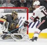  ?? JOHN LOCHER/AP ?? Golden Knights goalie Marc-Andre Fleury stops a shot by Hawks center Jonathan Toews.