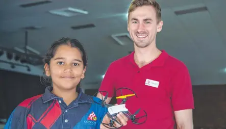  ??  ?? TEST FLIGHT: Concordia Lutheran College year 5 student Anjali Owens and Integrated­STEM director Fraser Border prepare for take off during the drone flying component of the STEM based workshop, Picture: Nev Madsen