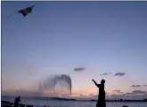  ??  ?? A boy flies a kite in Jiddah, Saudi Arabia.