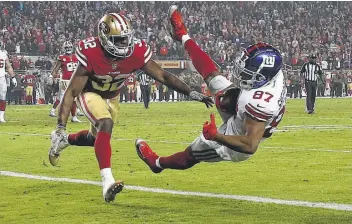  ?? Ezra Shaw / Getty Images ?? The Giants’ Sterling Shepard come down with a pass from Eli Manning for the game-winning touchdown reception with 53 seconds remaining Monday night.