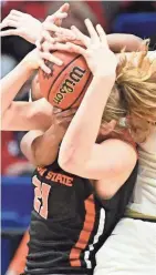  ?? JAMIE RHODES / USA TODAY SPORTS ?? Oregon State center Marie Gulich tangles with two Baylor players in a battle for a rebound Friday night.