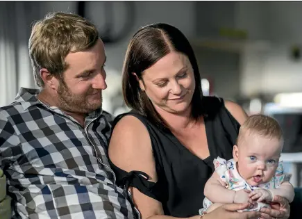  ?? PHOTOS: GEORGE HEARD/STUFF ?? Rachael Sibley and Kyle Torkington’s baby, Bella, was born too early at 25 weeks old – St John paramedics helped keep her alive with plastic wrap and a hat made out of one of Kyle’s socks.