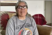  ?? KALLE BENALLIE — INDIAN COUNTRY TODAY VIA AP ?? Madonna Thunder Hawk, 83, sits in her home near Rapid City, S.D., on Feb. 9. She was one of the four women medics during the occupation of Wounded Knee, which started on Feb. 27, 1973 and ended May 8, 1973.