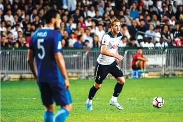  ?? — AFP photo ?? Tottenham Hotspur's English striker Harry Kane (R) controls the ball during the friendly football match between Tottenham Hotspurs and Kitchee FC at Hong Kong Stadium on May 26, 2017.