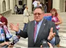  ?? Photograph: David Eggert/AP ?? Shelby Township clerk Stan Grot speaks with reporters on 22 August 2017, in front of the state capitol in Lansing, Michigan.