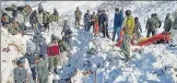  ?? PTI ?? Rescue workers clear snow after an avalanche near Jawahar Tunnel in Jammu and Kashmir on Friday.
