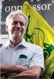  ??  ?? Controvers­ial: Mr Corbyn and the Hezbollah flag